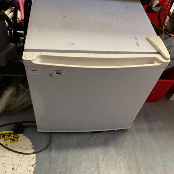 White compact mini fridge for small spaces and portable cooling.