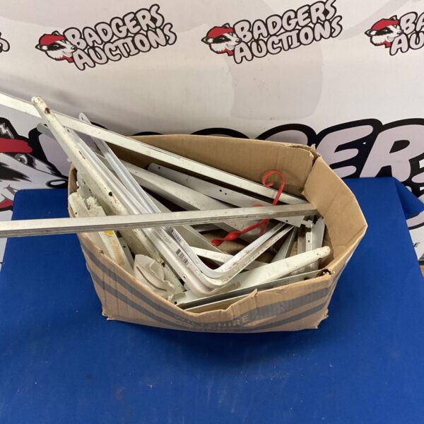 White powder-coated steel shelf brackets and mounting hardware lot.