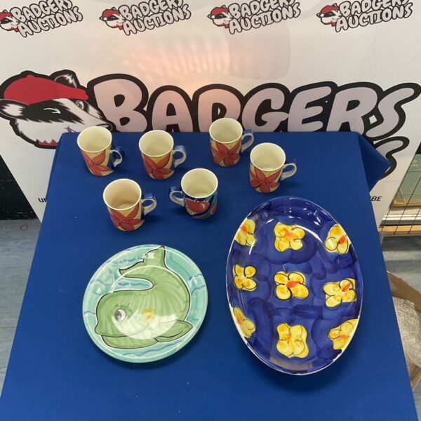Whittard hand painted tea set with floral designs on porcelain cups and plates.