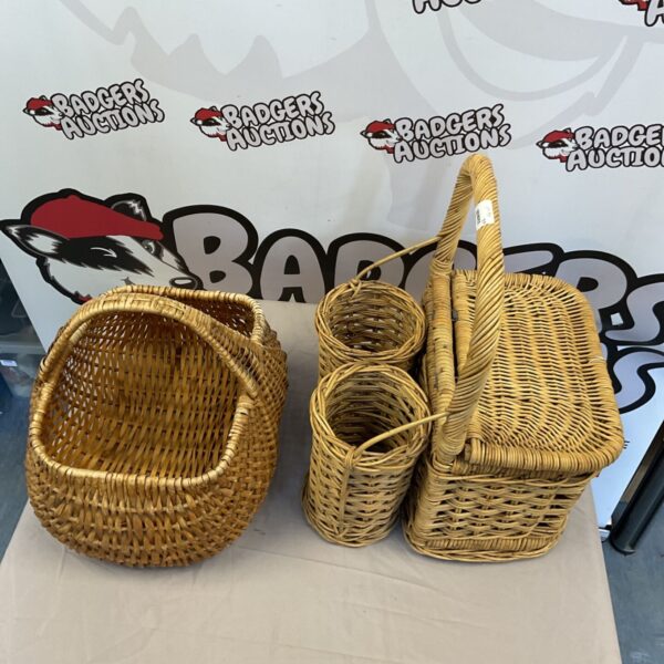 Vintage wicker picnic baskets, a charming woven set for storage.