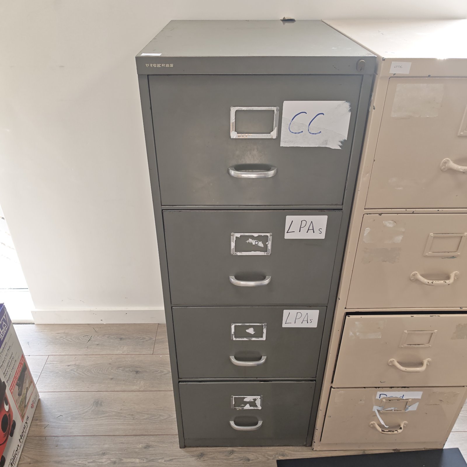 Vintage metal filing cabinet by Wickers with four drawers.