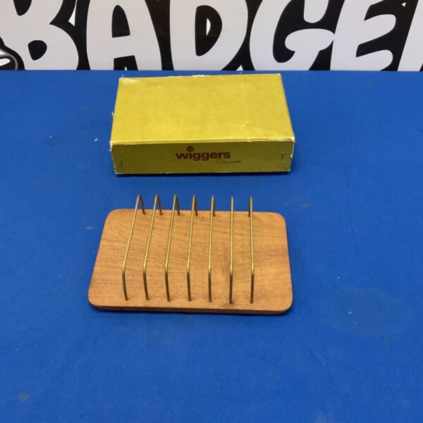 Vintage Wiggers of Denmark wooden toast rack for holding toast.
