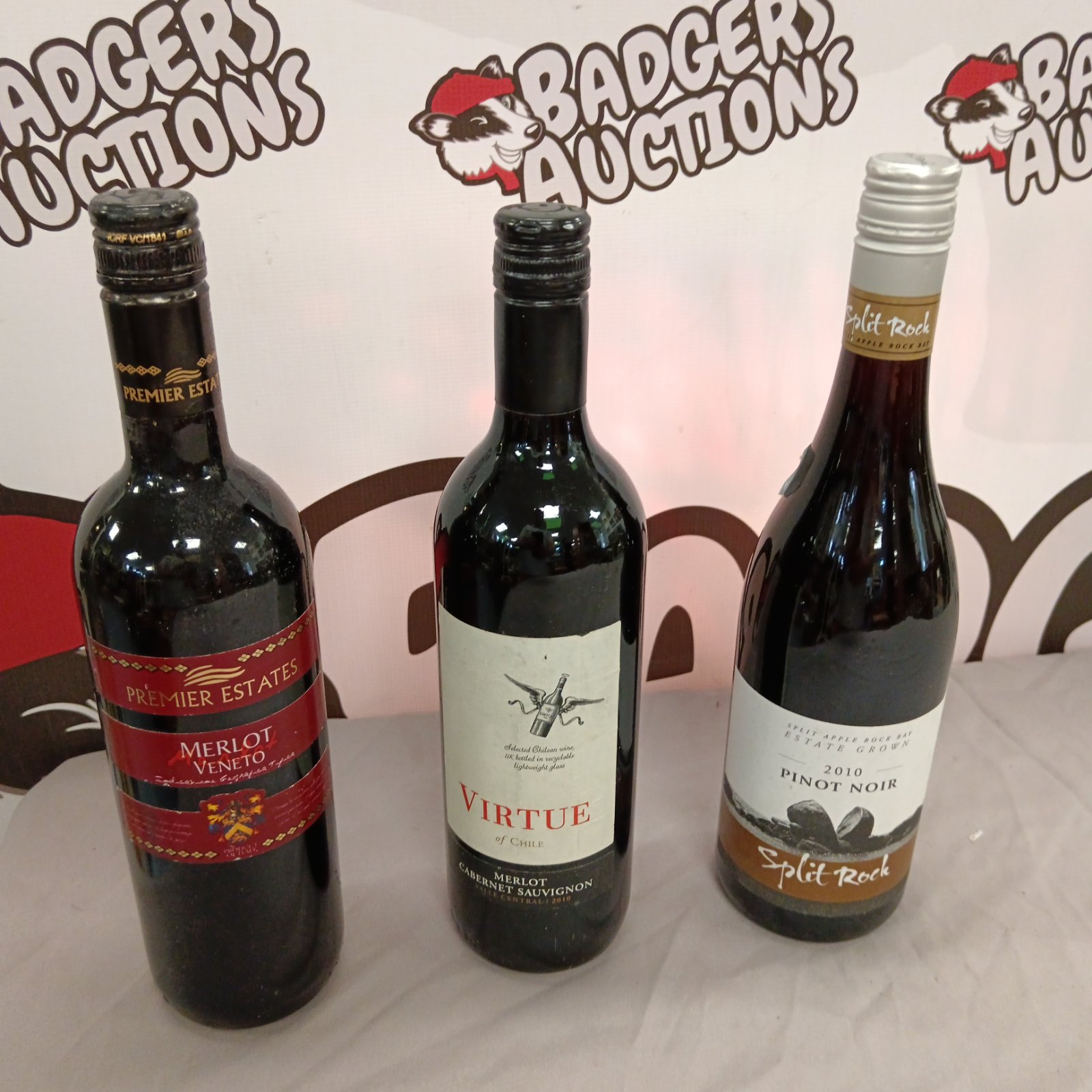 Three bottles of wine including Split Rock and Virtue.