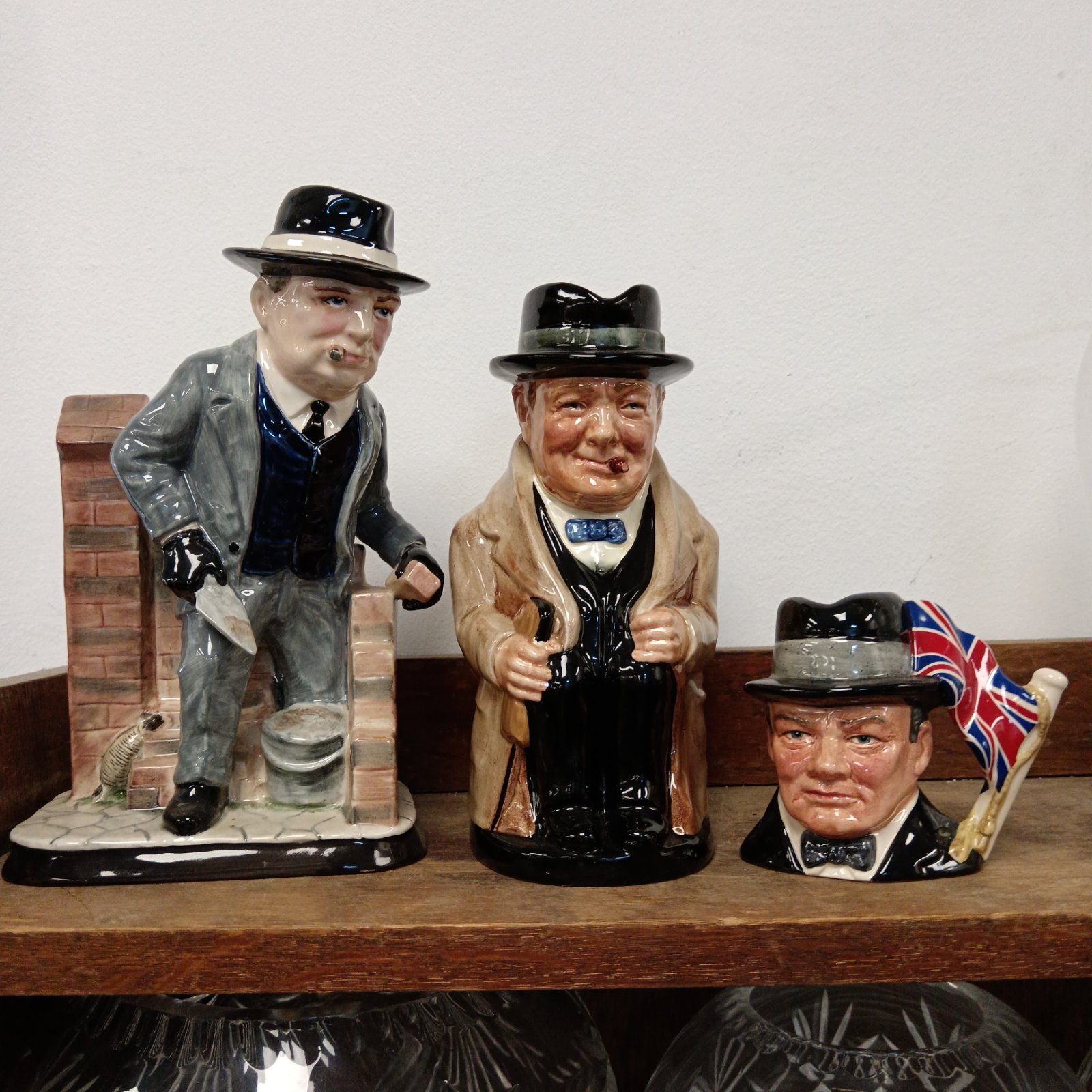 Winston Churchill figurine and Royal Doulton character jugs collectible pottery.