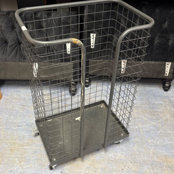 Grey wire mesh industrial trolley for storage and distribution.