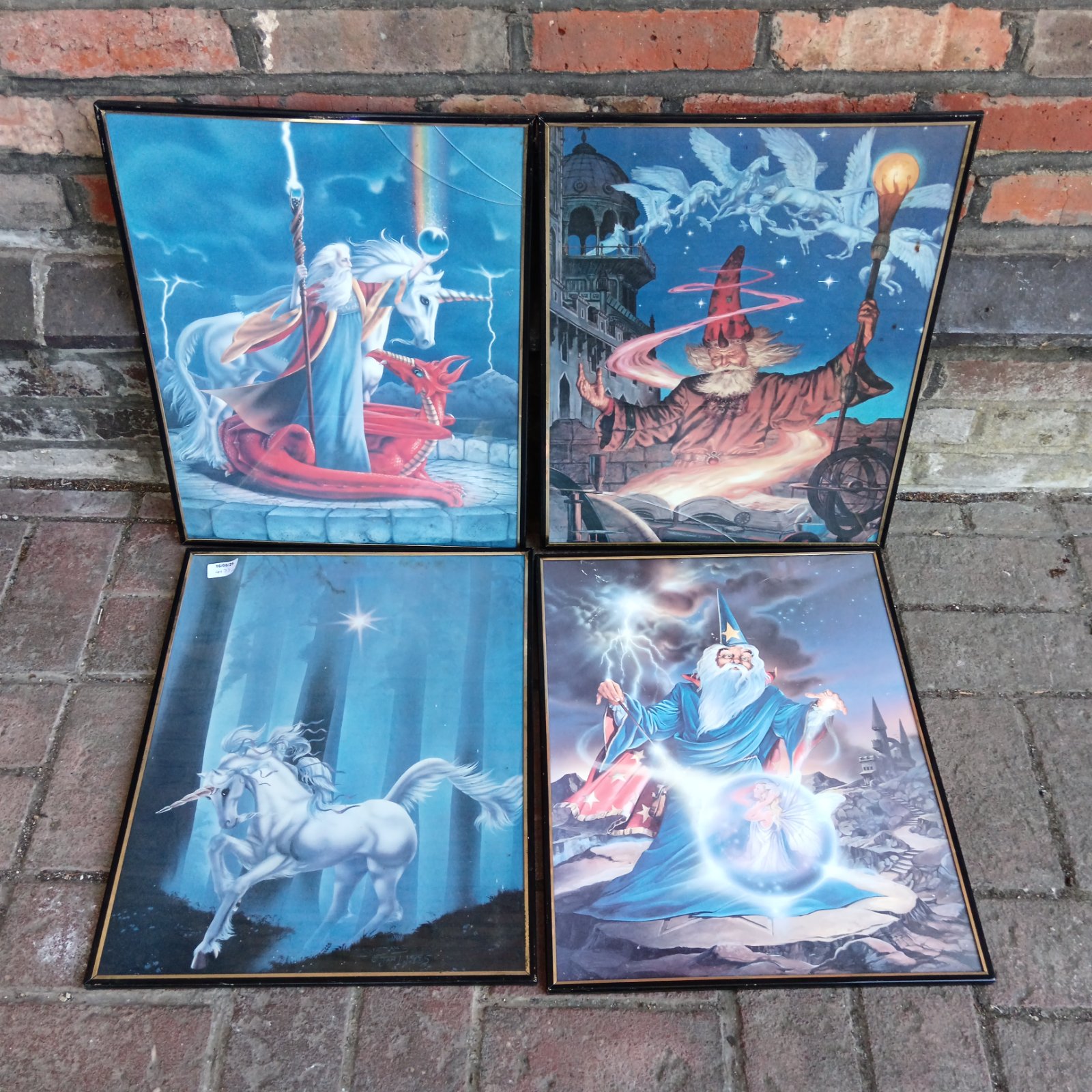 Vintage wizard battling a dragon fantasy print framed in black.