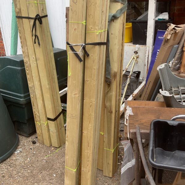 Bundle of wood outdoors, ideal for DIY and construction projects.