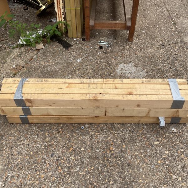 Stack of twelve wood planks for DIY projects.