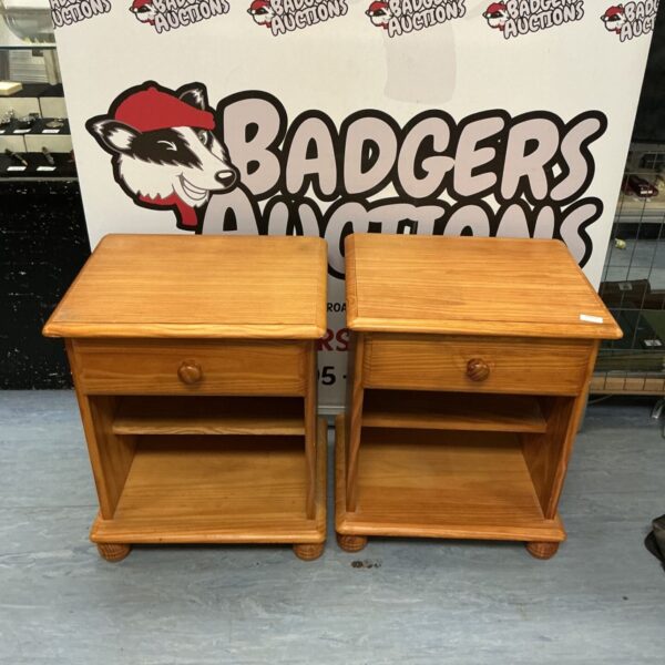 Pair of wooden bedside tables with a drawer and shelf.