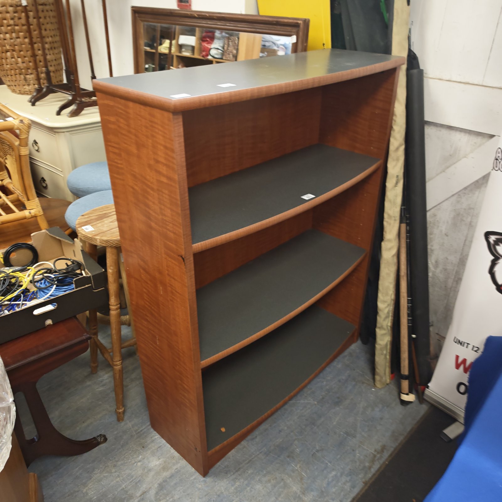 Vintage wooden book shelf with three tiers for storage.