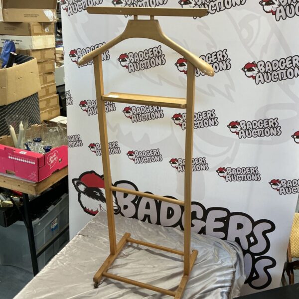 Vintage wooden clothes rail for displaying gentleman’s garments.