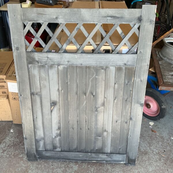 Rustic wooden garden gate with rhombus design for outdoor spaces.