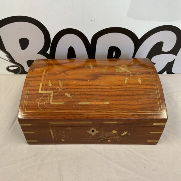 Vintage wooden jewellery box with brass floral inlay detail.