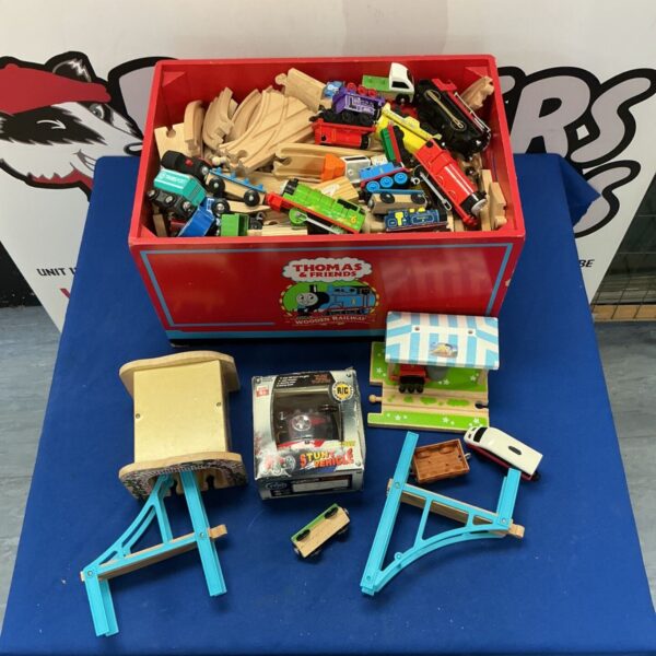 Wooden Thomas & Friends train set with track pieces in a red box.