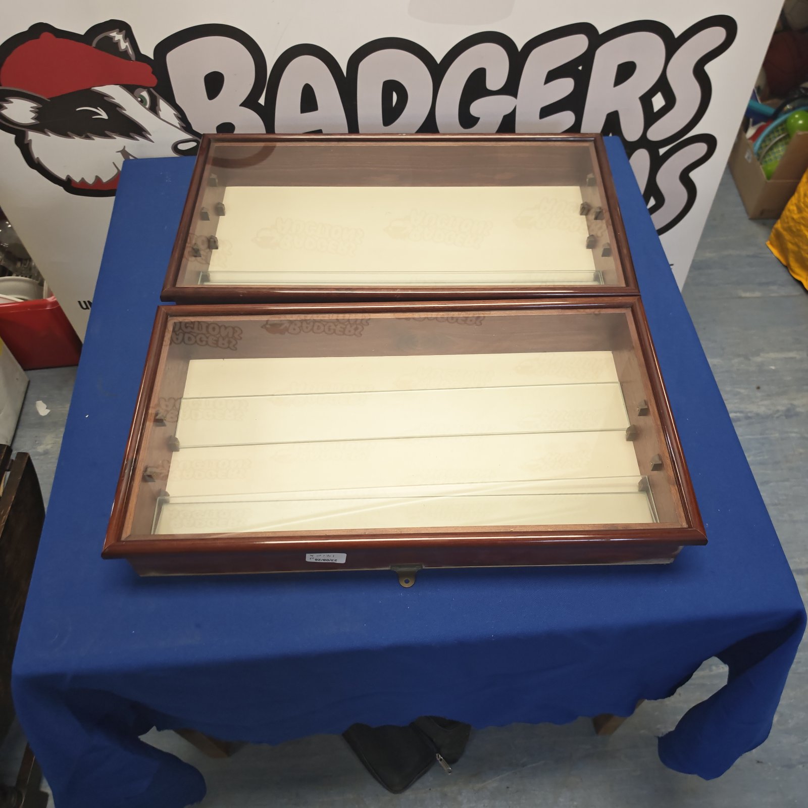 Vintage wooden wall display cabinet with glass front.