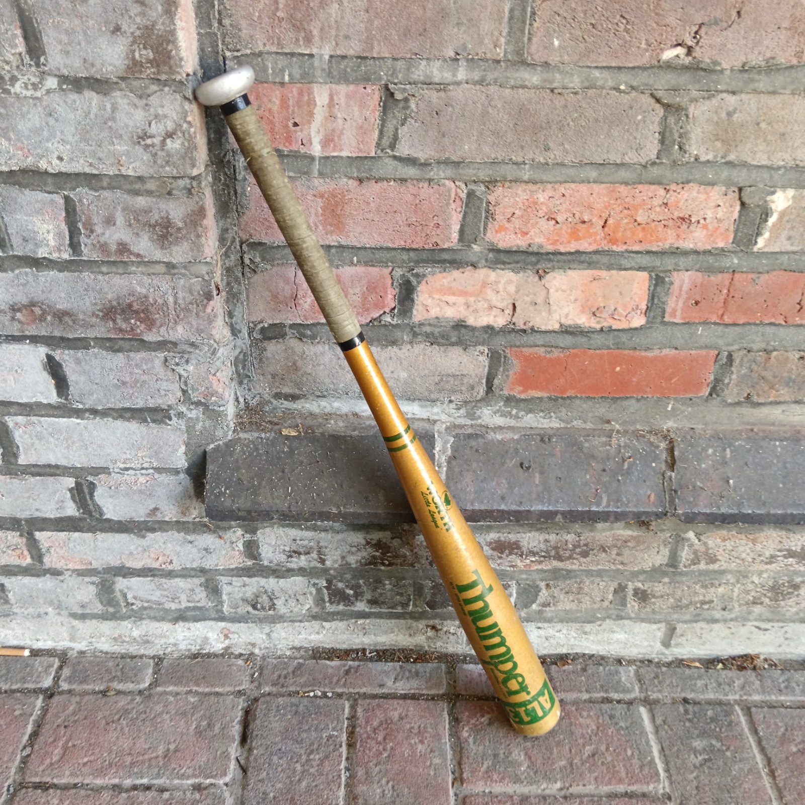 Yellow and black Worth little league aluminium baseball bat.