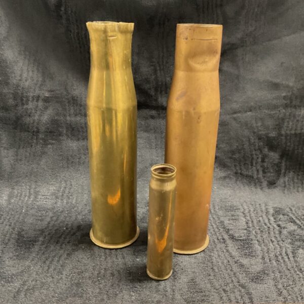 Vintage WW2 brass shell casings, a lot of three.