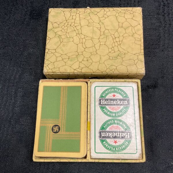 WWII German playing cards and Heineken cards, vintage collectible set.