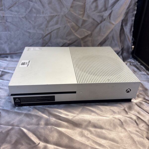 Front view of a white Microsoft Xbox One S gaming console.