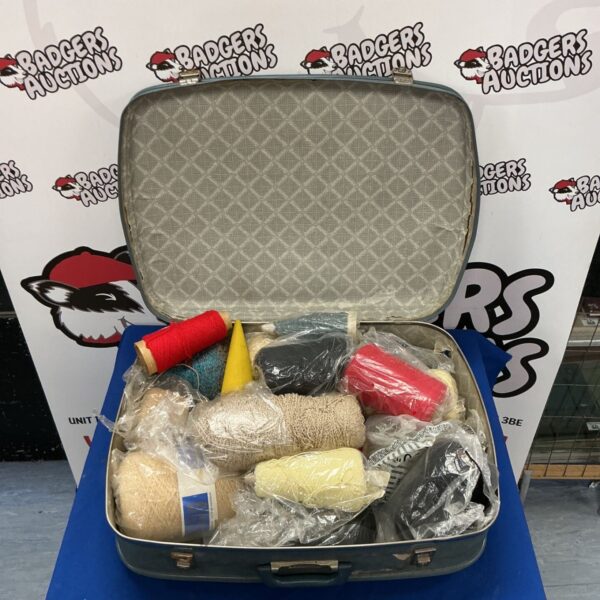 Vintage Spartan case filled with colourful yarn for crafting.