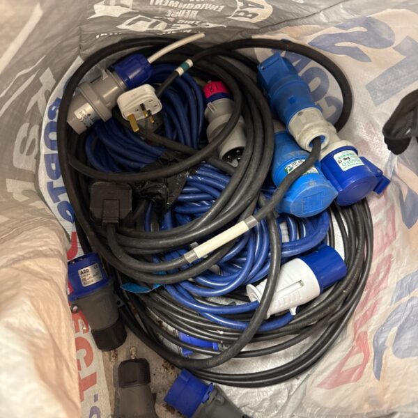 Lot of blue 16a power connector cables for electrical projects.