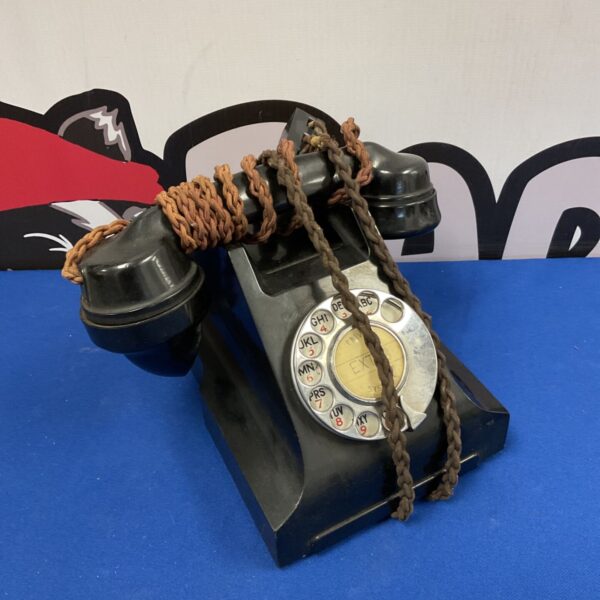 Vintage 1930s Bakelite rotary telephone in black.