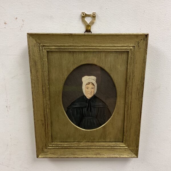 Early 19th century watercolour miniature portrait of a lady in a bonnet.