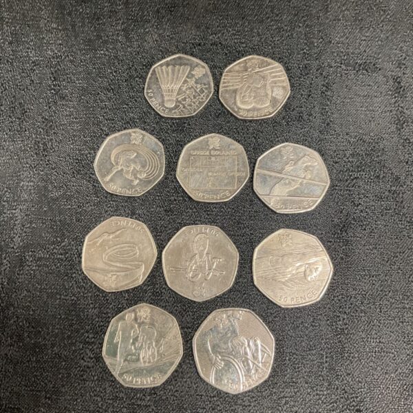 Collection of 2011 Olympic 50p coins, featuring various sports designs.