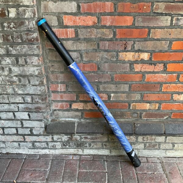 Hand-painted Aboriginal didgeridoo with a crocodile design.