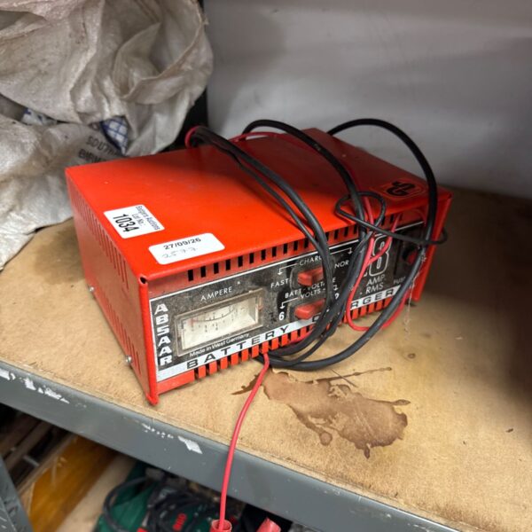 Vintage Absaar 12v battery charger with visible model number.