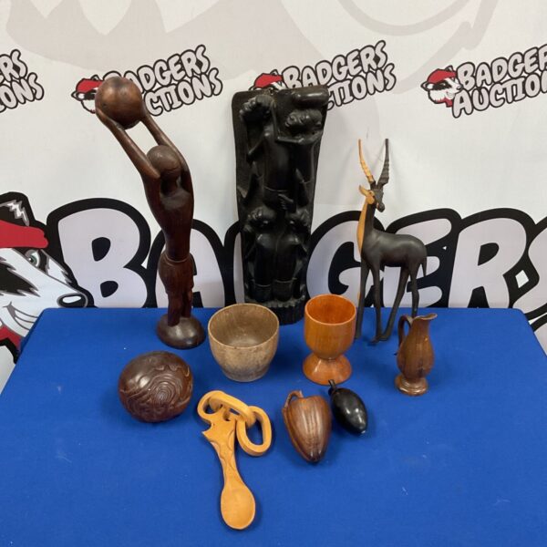 Selection of authentic African wood carvings depicting figures.
