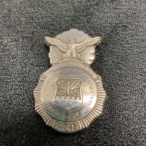 Front view of vintage Air Force Security Police badge with eagle emblem.