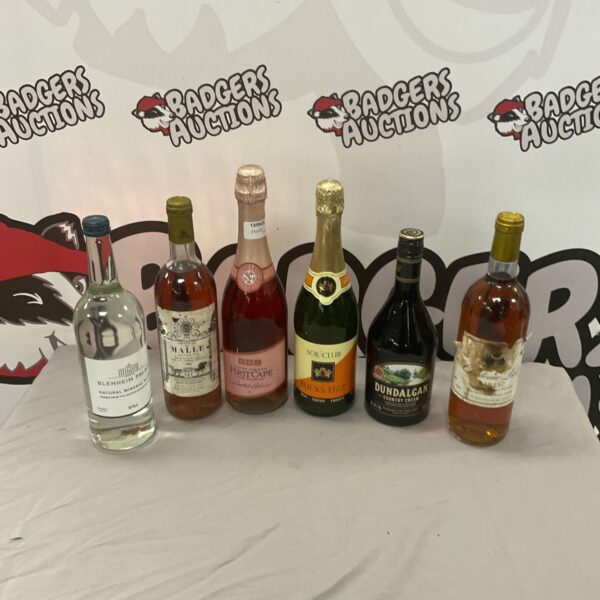 Mixed lot of alcohol bottles and Blenheim Palace mineral water.
