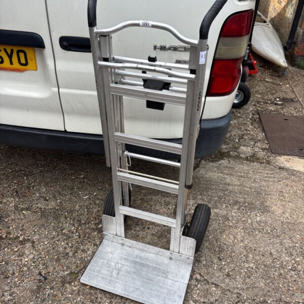 Foldable aluminium hand truck for light duty transport and storage.