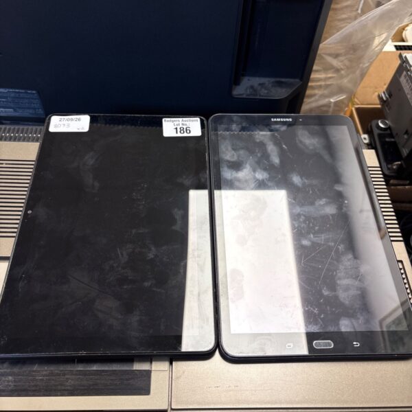 Two tablets, an Amazon Fire and a Samsung, presented as a lot.
