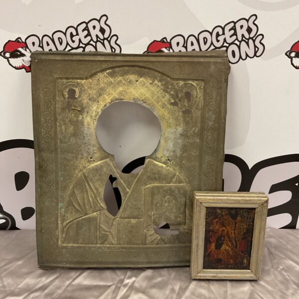 Antique brass oklad with miniature icon, religious art detail.