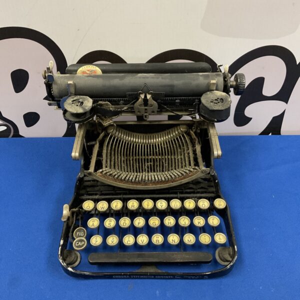 Antique Corona typewriter, a vintage mechanical writing machine.