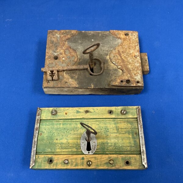 Antique door locks with keys, vintage security hardware.