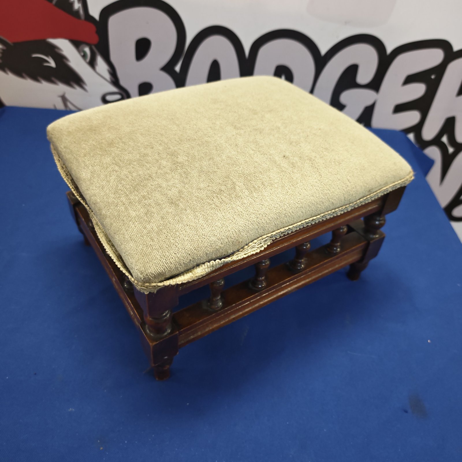 Antique Victorian foot stool with patterned fabric upholstery.
