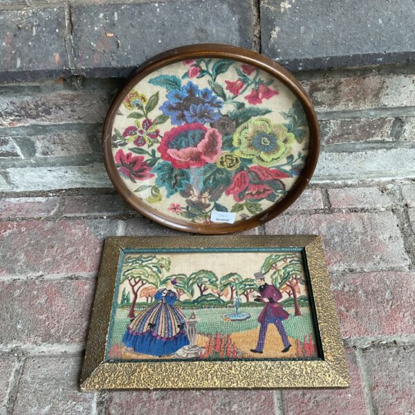 Antique framed tapestry pair with floral design and figures.