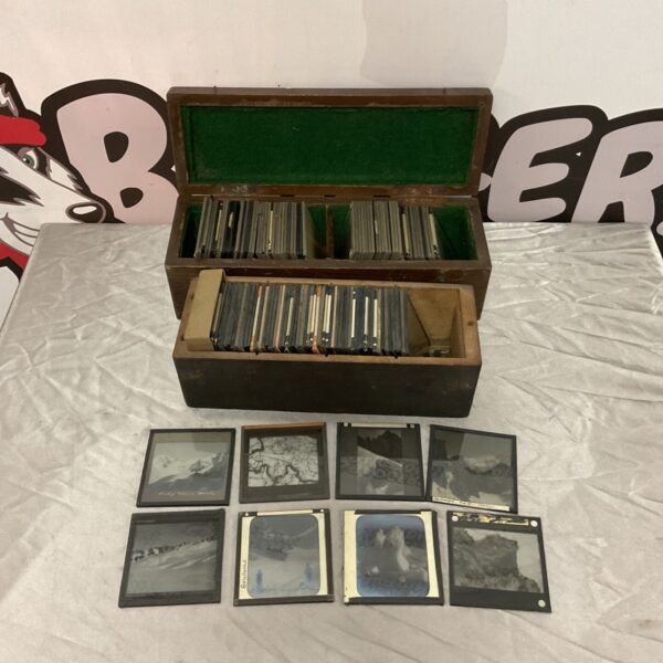 Antique magic lantern slides in a wooden box, a Victorian collectible.