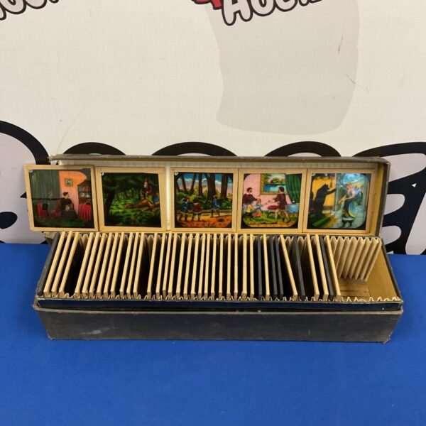 Antique magic lantern slides depicting colourful fairy tale scenes.