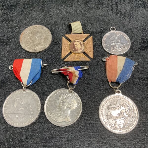 Antique British medal collection with ribbons, a fascinating historical display.