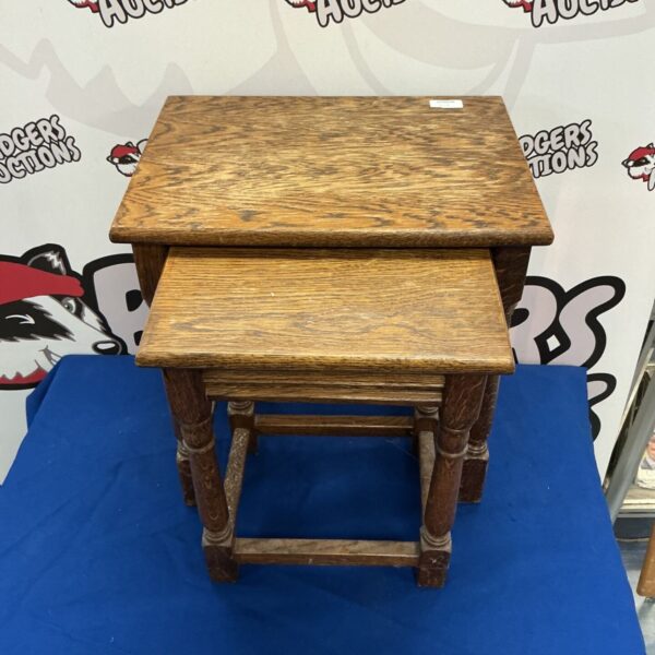 Antique wooden nest of tables with turned legs.