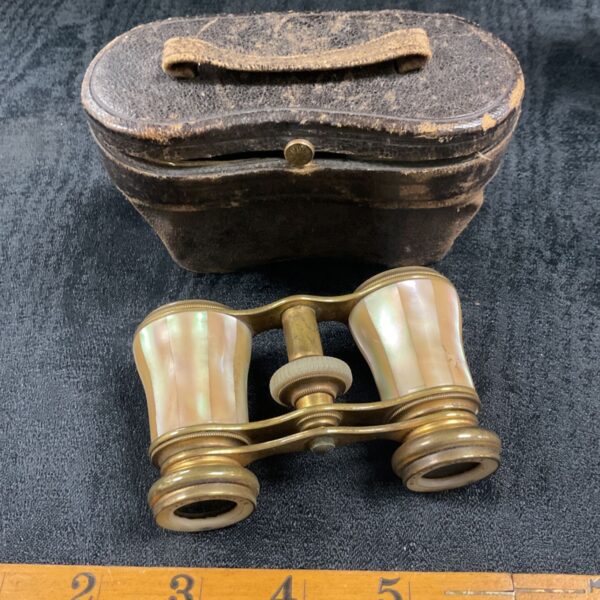 Antique opera glasses with mother of pearl and leather case.