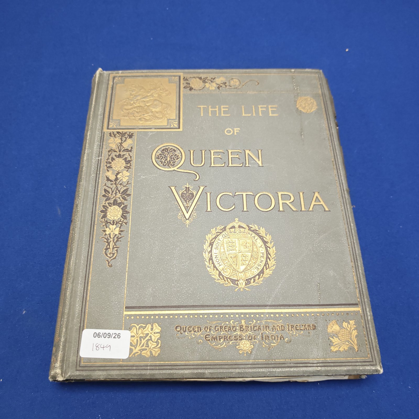 Antique book cover of "The Life of Queen Victoria"