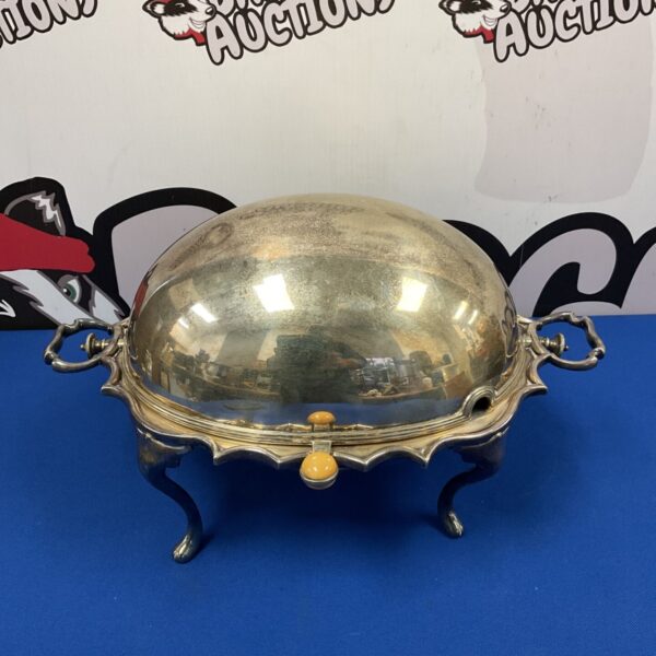Antique silver plate breakfast warmer with revolving dome.