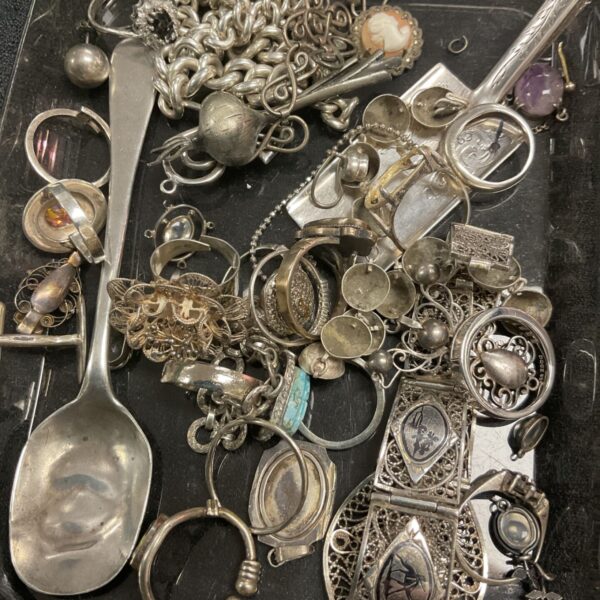 Antique silver scrap lot with Georgian spoon, bracelets and rings.