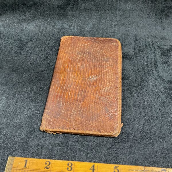 Antique snake skin wallet from the 1920s, showing detailed texture.