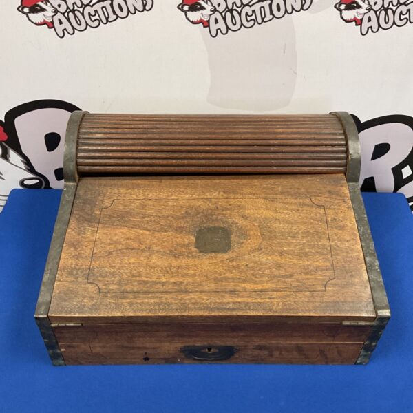 Antique Victorian writing slope with roll top and brass fittings.